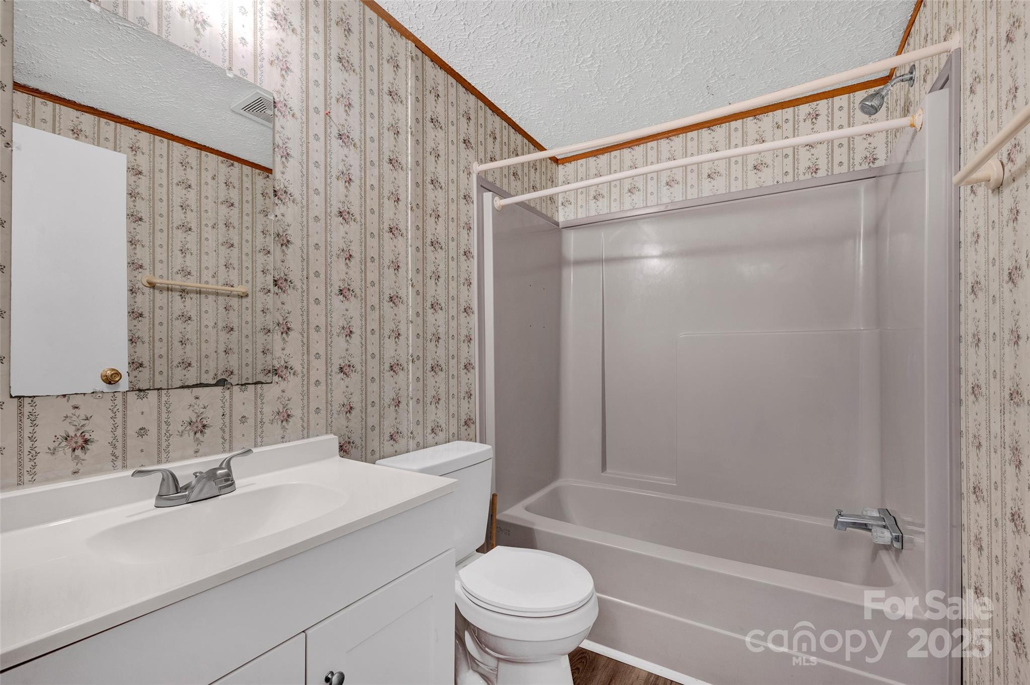 4586 Deal Road Claremont, NC 28610 - Photo 19 of 24 a bathroom with a sink a toilet and shower