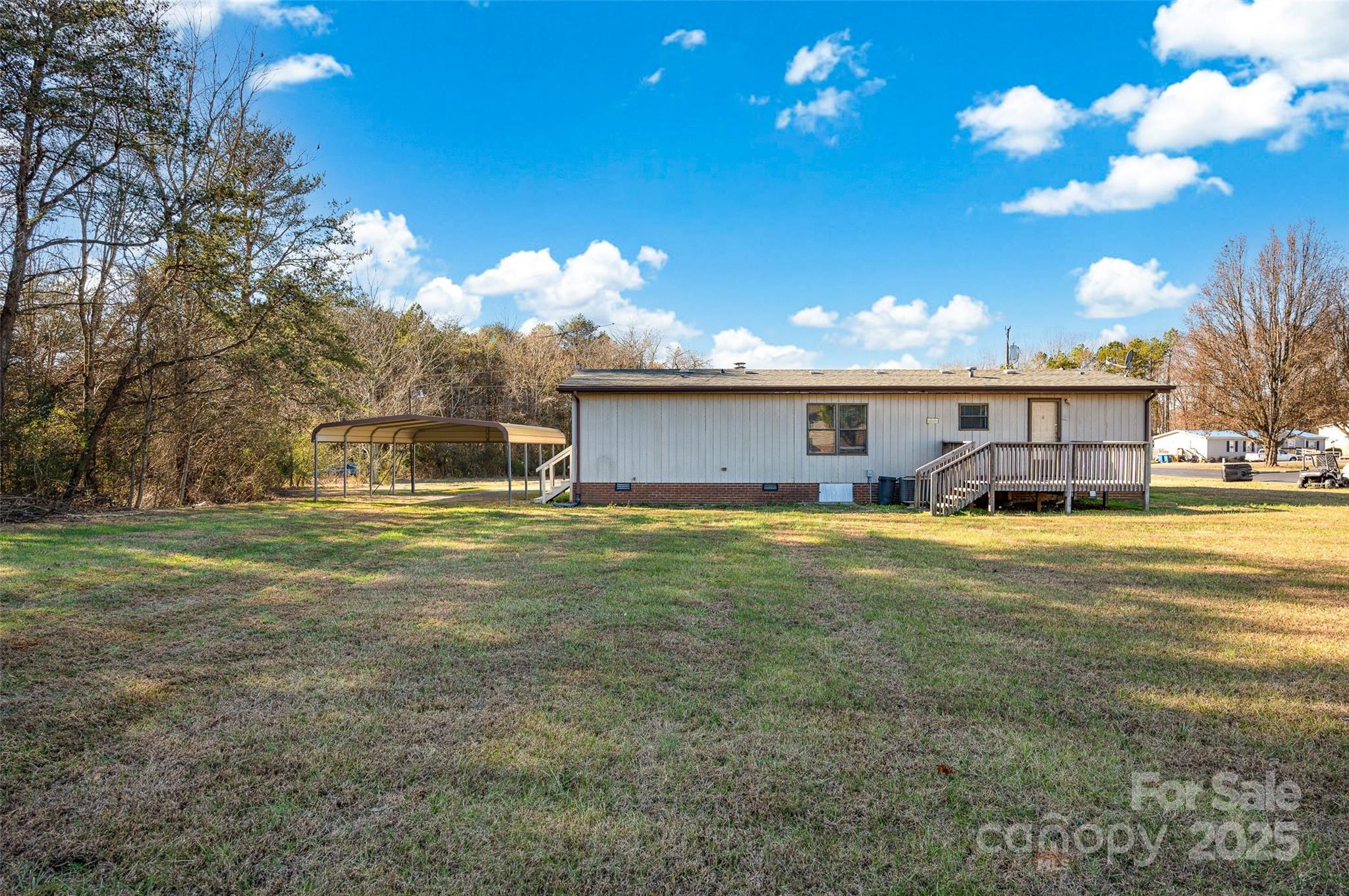 4586 Deal Road Claremont, NC 28610 - Photo 23 of 24 a front view of a house with a garden