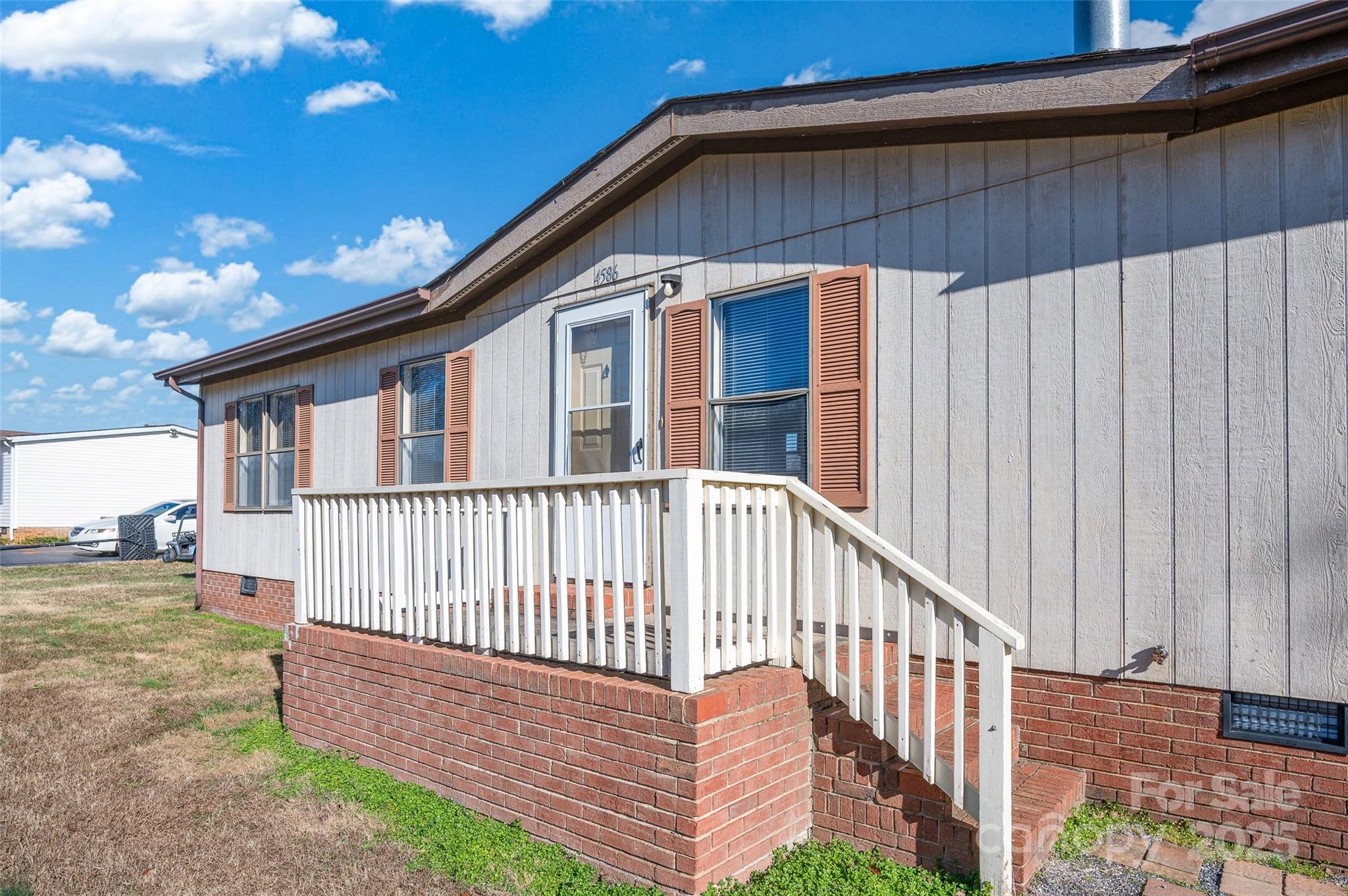 4586 Deal Road Claremont, NC 28610 - Photo 3 of 24 a view of a house with a yard and deck