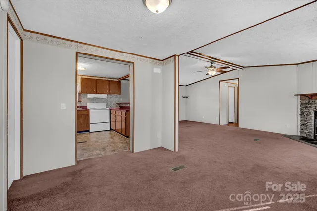 a view of a big room with a cabinet and mirrors