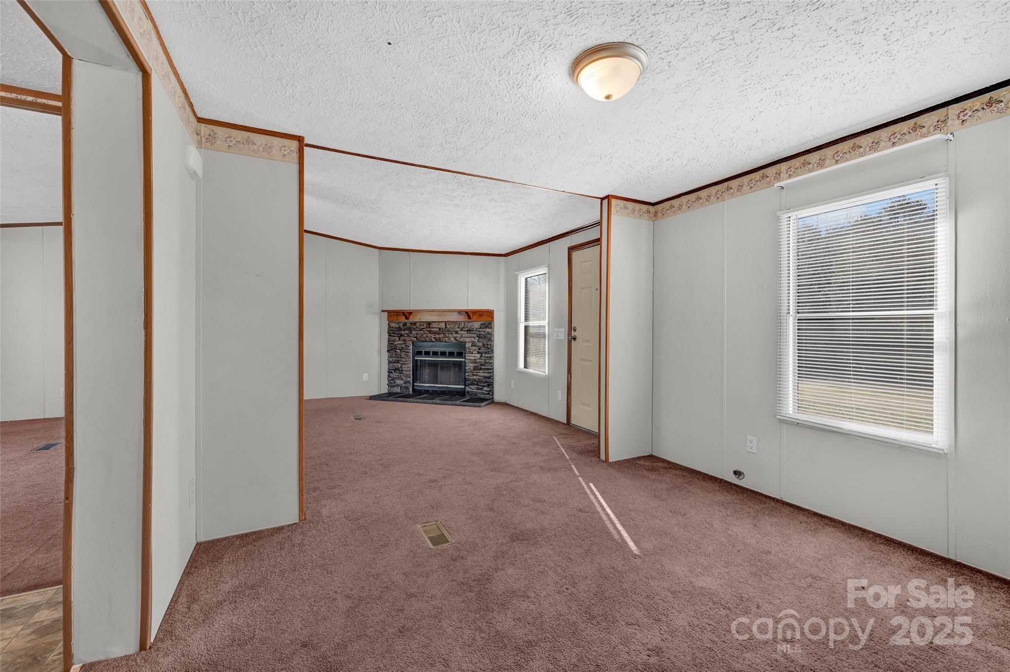 4586 Deal Road Claremont, NC 28610 - Photo 9 of 24 a view of livingroom with a ceiling fan and window