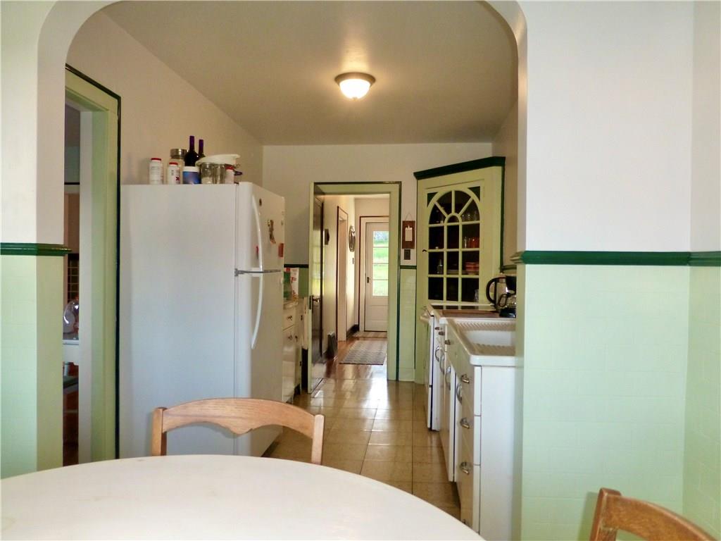 526 Ridge Avenue East Pittsburgh, PA 15112 - Photo 10 of 25 13x8 Kitchen has a refrigerator and a large sink.