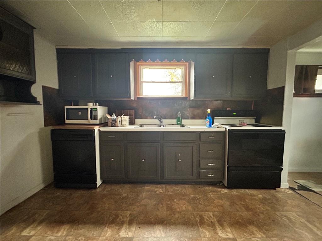 1347 High Road Clairton, PA 15025 - Photo 6 of 21 a kitchen with a sink a stove and cabinets