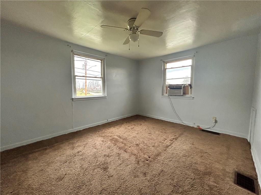 1347 High Road Clairton, PA 15025 - Photo 9 of 21 an empty room with windows and fan