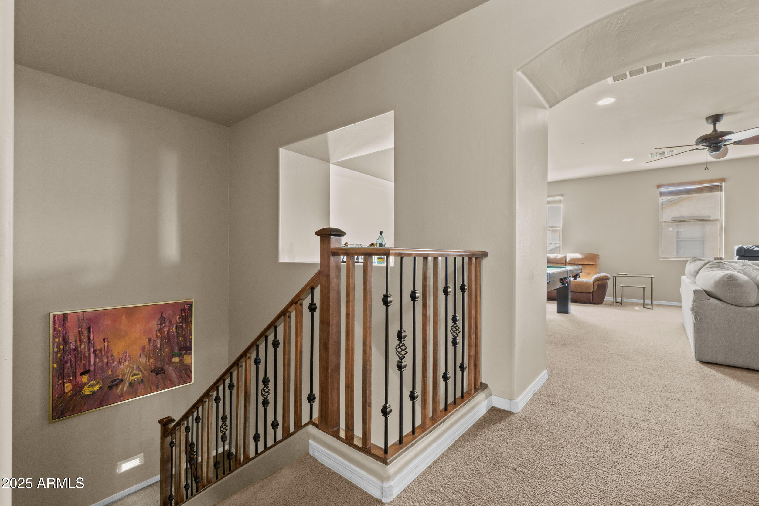 2879 East Janelle Way Gilbert, AZ 85298 - Photo 9 of 33 a view of a hallway with paintings on the wall