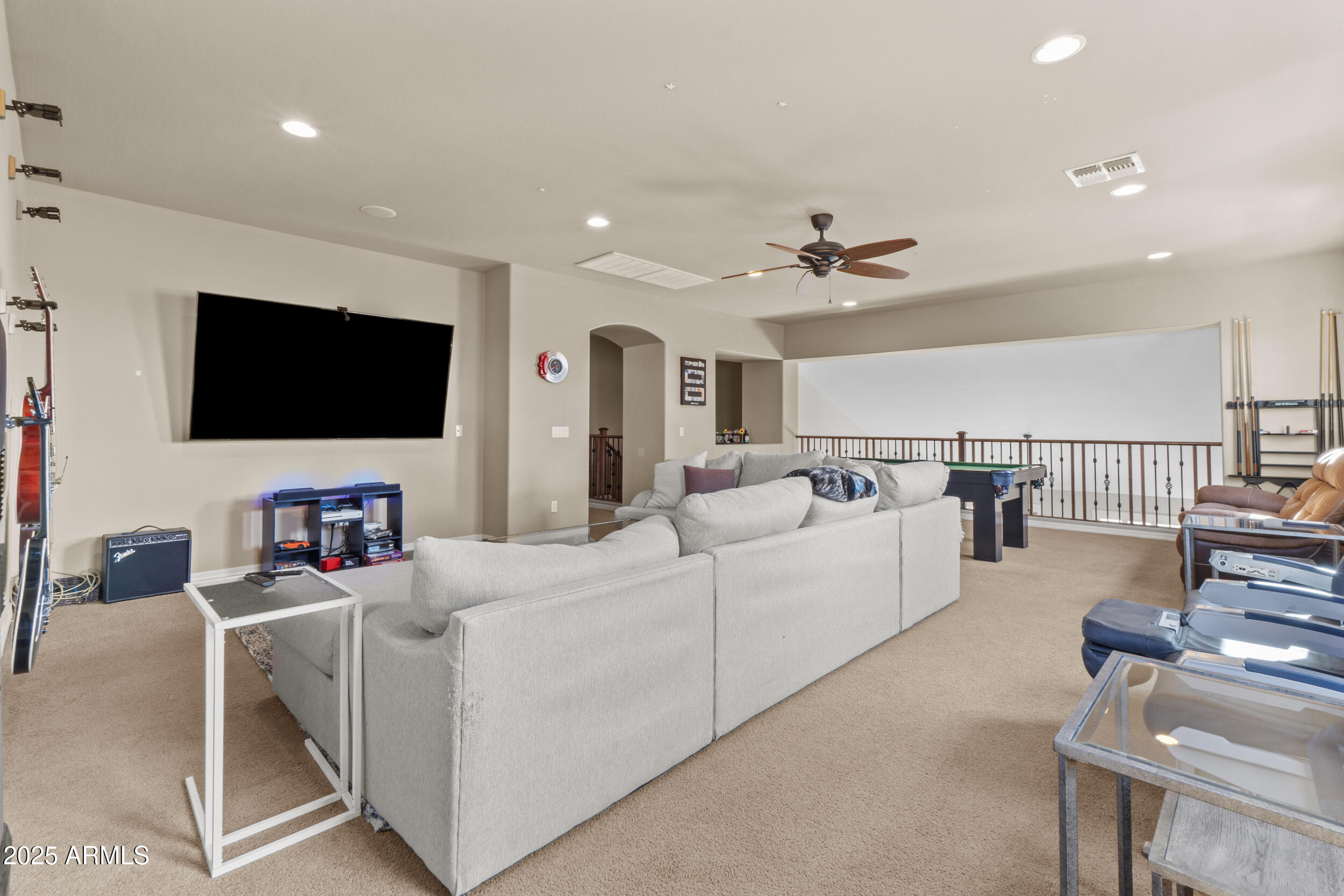 2879 East Janelle Way Gilbert, AZ 85298 - Photo 10 of 33 a living room with furniture and a flat screen tv