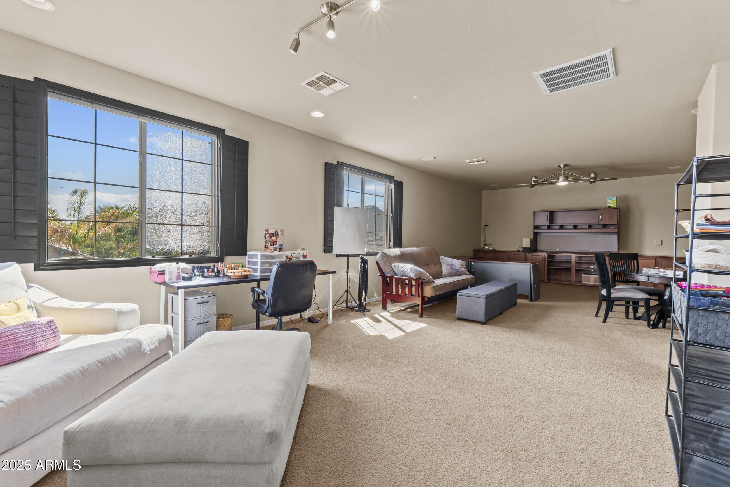 2879 East Janelle Way Gilbert, AZ 85298 - Photo 19 of 33 a living room with furniture and a large window
