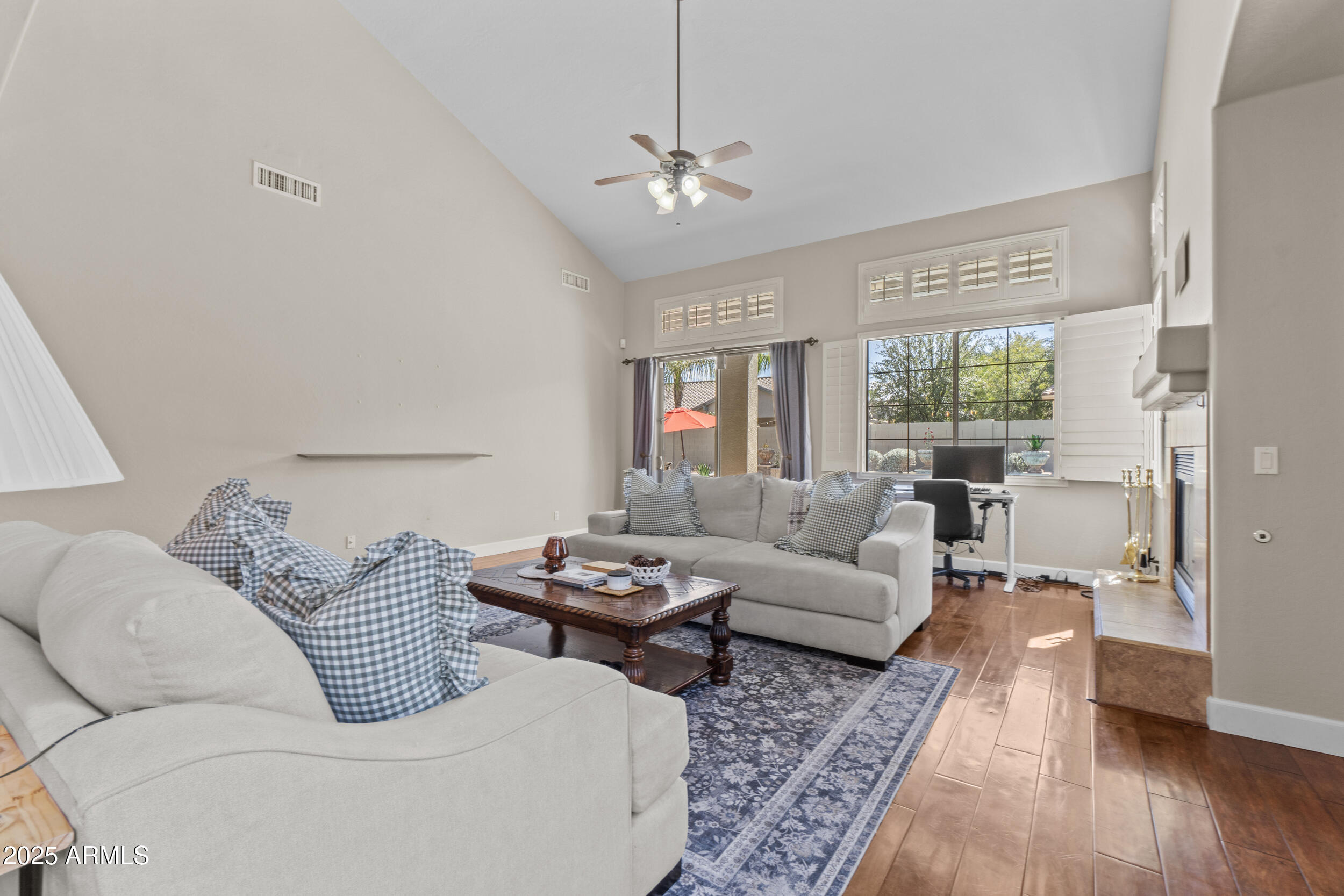 2879 East Janelle Way Gilbert, AZ 85298 - Photo 3 of 33 a living room with furniture and wooden floor