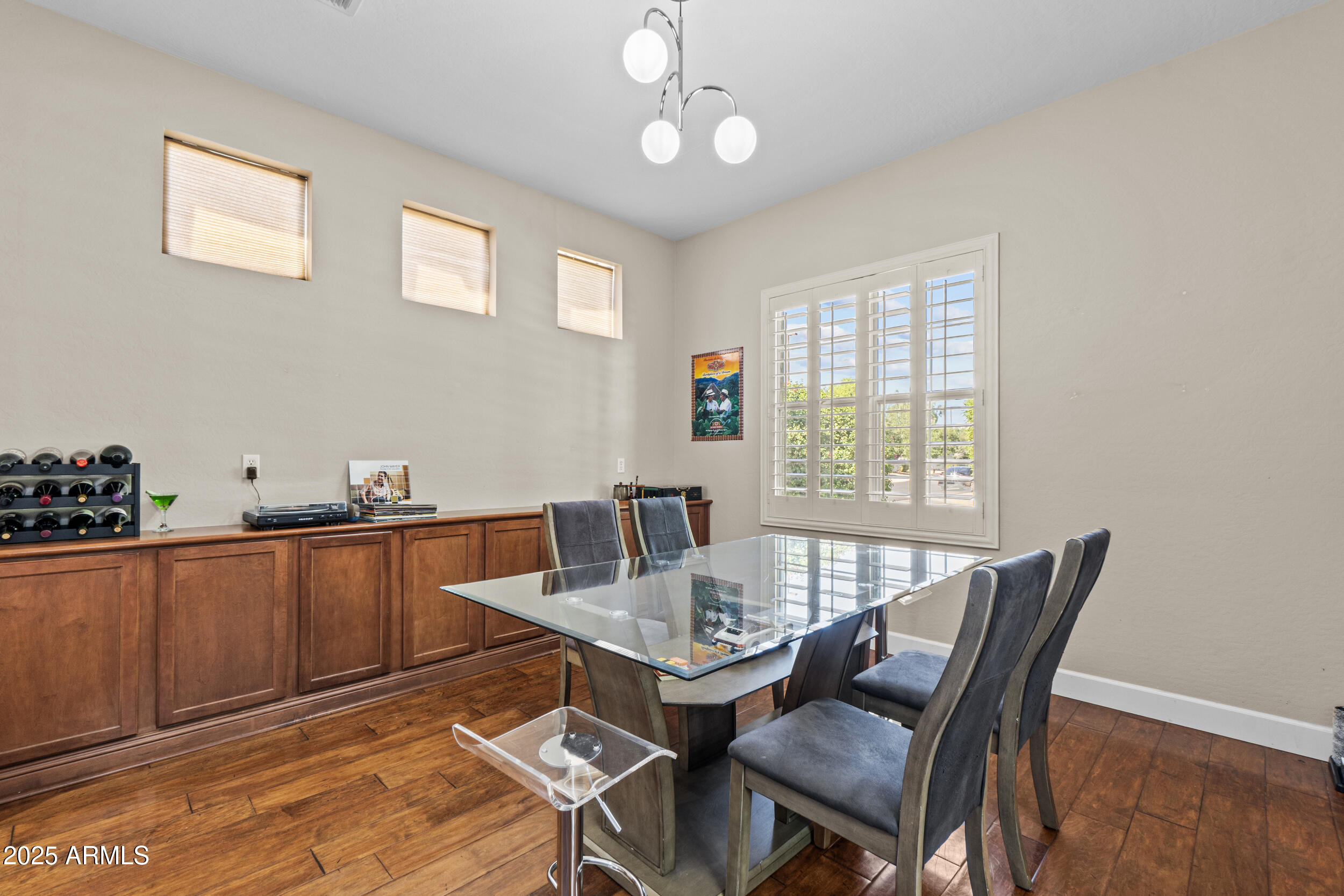 2879 East Janelle Way Gilbert, AZ 85298 - Photo 7 of 33 a view of a dining room with furniture window and wooden floor