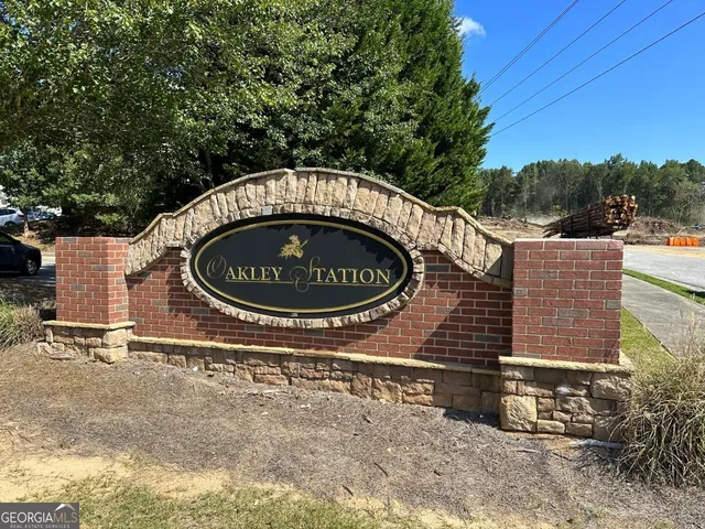 a blue sign that is sitting in front of a house