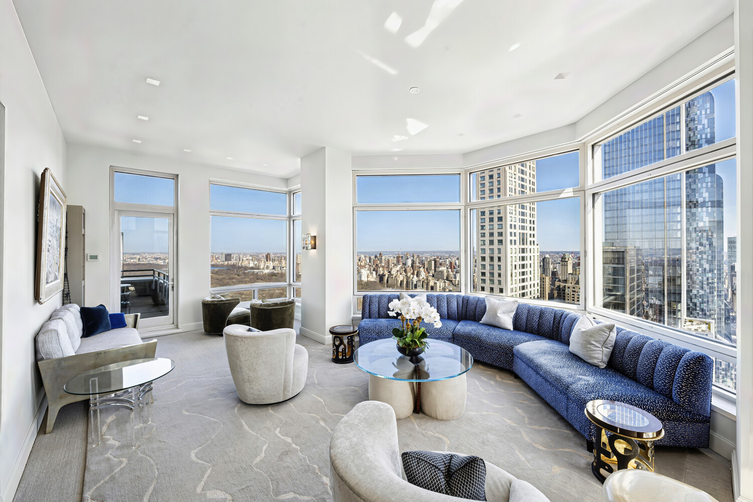 301 West 57th Street, Unit 52C Manhattan, NY 10019 - Photo 1 of 13 a living room with furniture and a large window