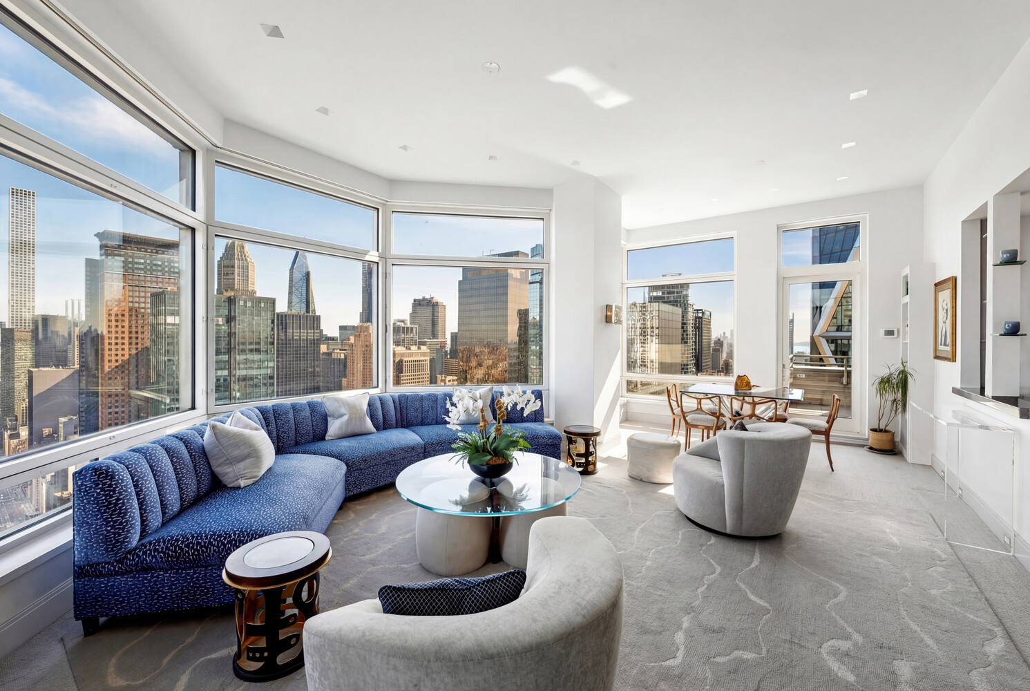 301 West 57th Street, Unit 52C Manhattan, NY 10019 - Photo 4 of 13 a living room with furniture and a large window