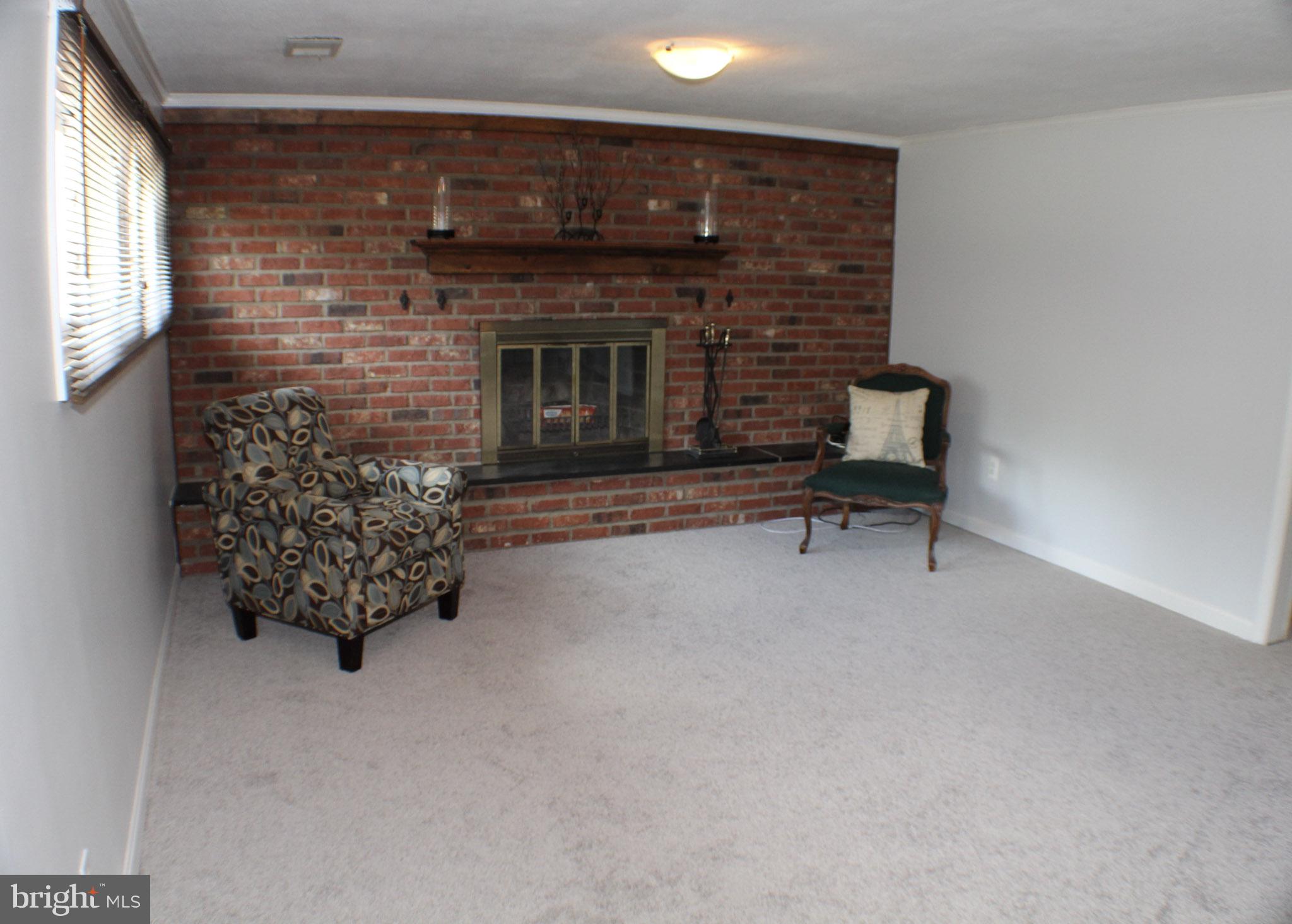 502 Berwyn Road Morrisville, PA 19067 - Photo 11 of 33 Great room with wood burning fireplace