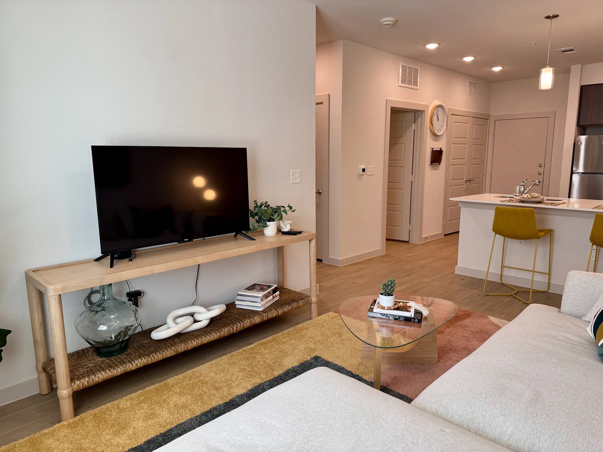 320 Goll Street, Unit 2405 Kyle, TX 78640 - Photo 14 of 19 a living room with furniture and a flat screen tv