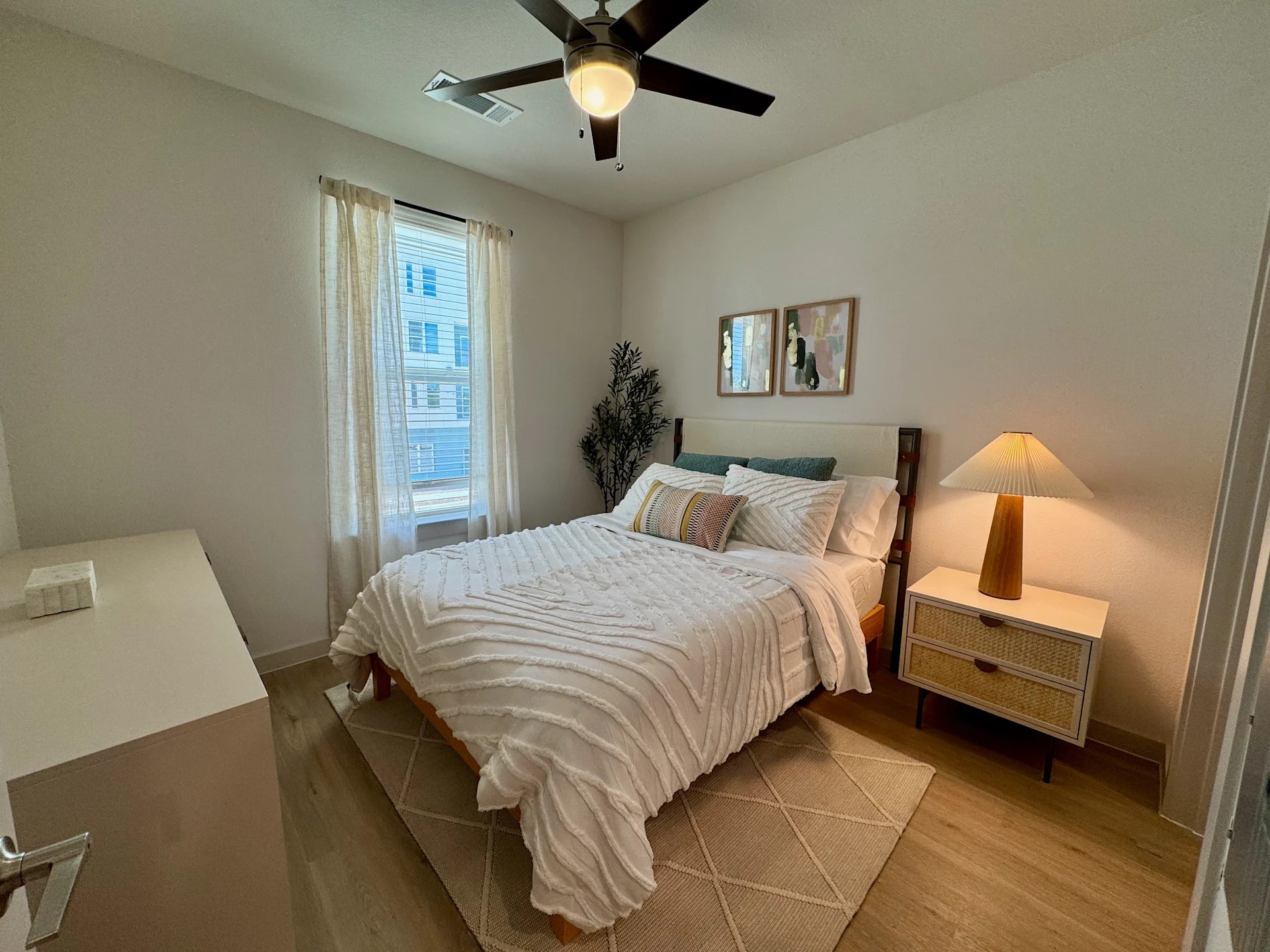 320 Goll Street, Unit 2405 Kyle, TX 78640 - Photo 5 of 19 a bedroom with bed and window