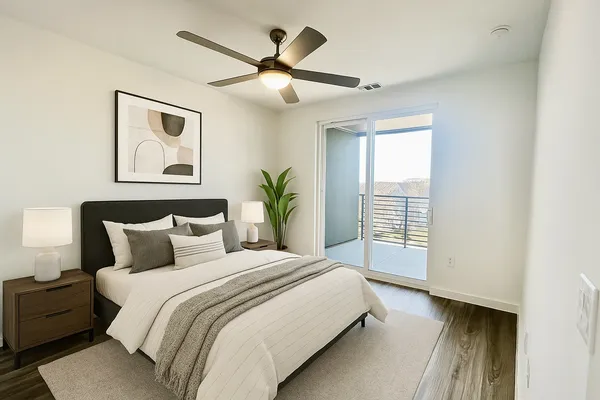 a bedroom with a large bed and a window