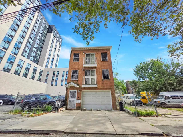 a front view of a building with garden