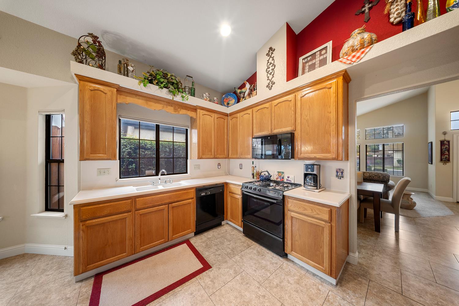 1837 Brookside Drive Manteca, CA 95336 - Photo 13 of 36 a large kitchen with stainless steel appliances granite countertop a sink and cabinets