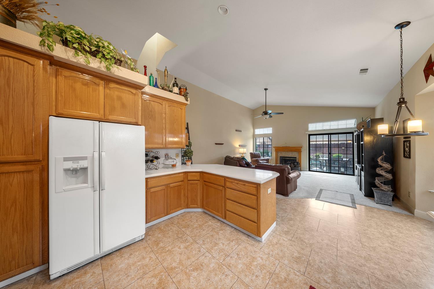 1837 Brookside Drive Manteca, CA 95336 - Photo 14 of 36 a kitchen with refrigerator a sink and a stove
