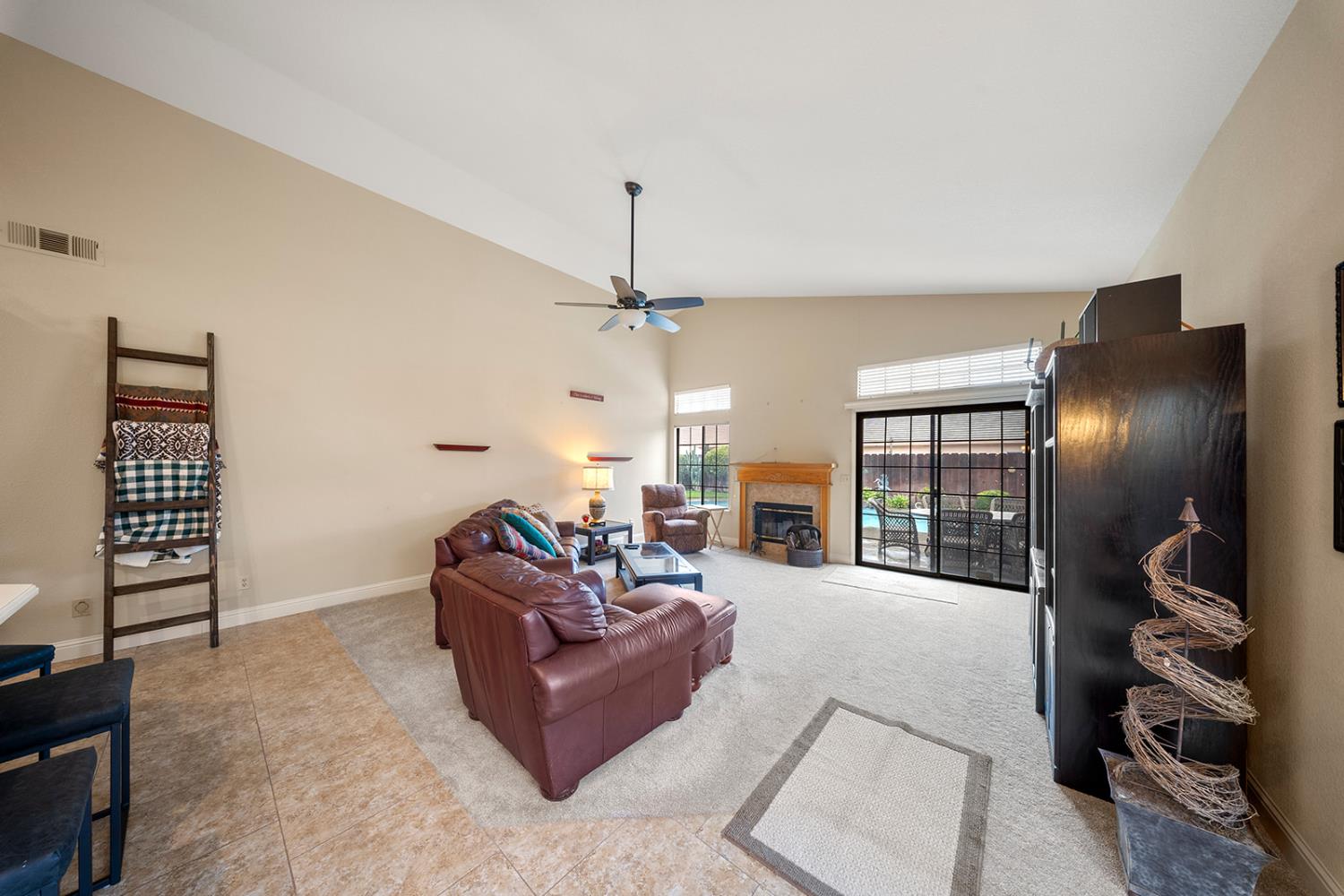 1837 Brookside Drive Manteca, CA 95336 - Photo 15 of 36 a living room with furniture and a chandelier