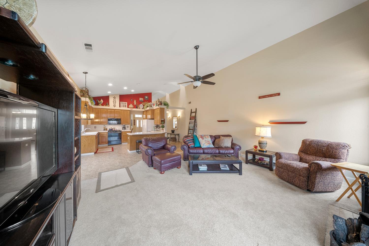 1837 Brookside Drive Manteca, CA 95336 - Photo 17 of 36 a living room with furniture and a flat screen tv