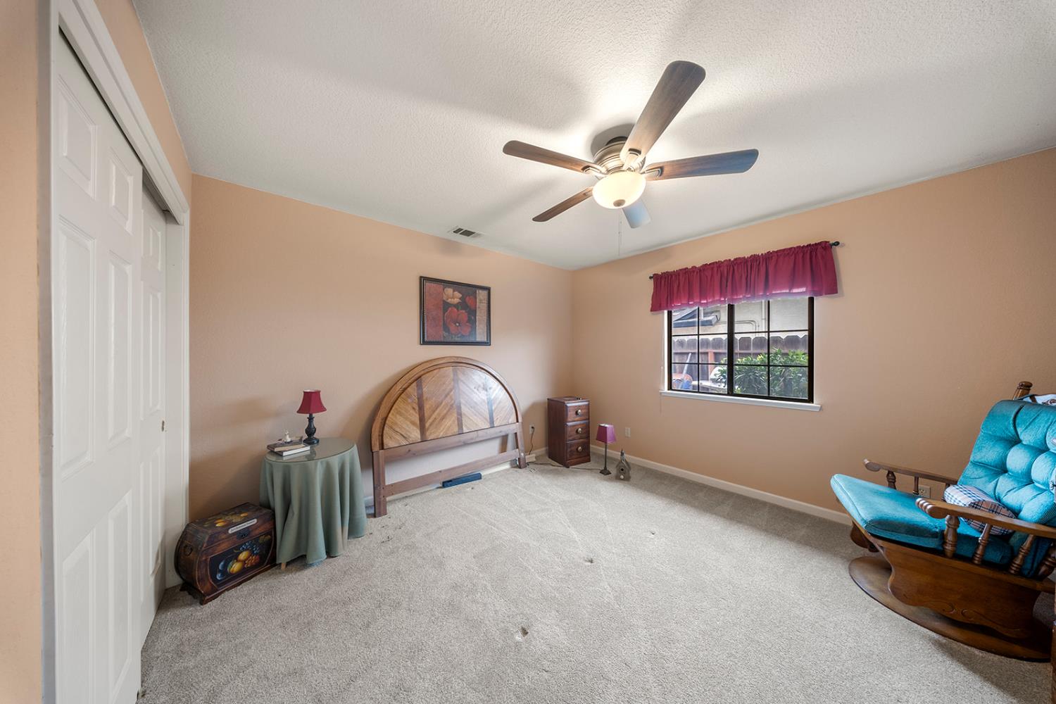 1837 Brookside Drive Manteca, CA 95336 - Photo 22 of 36 a view of a livingroom with furniture and a ceiling fan