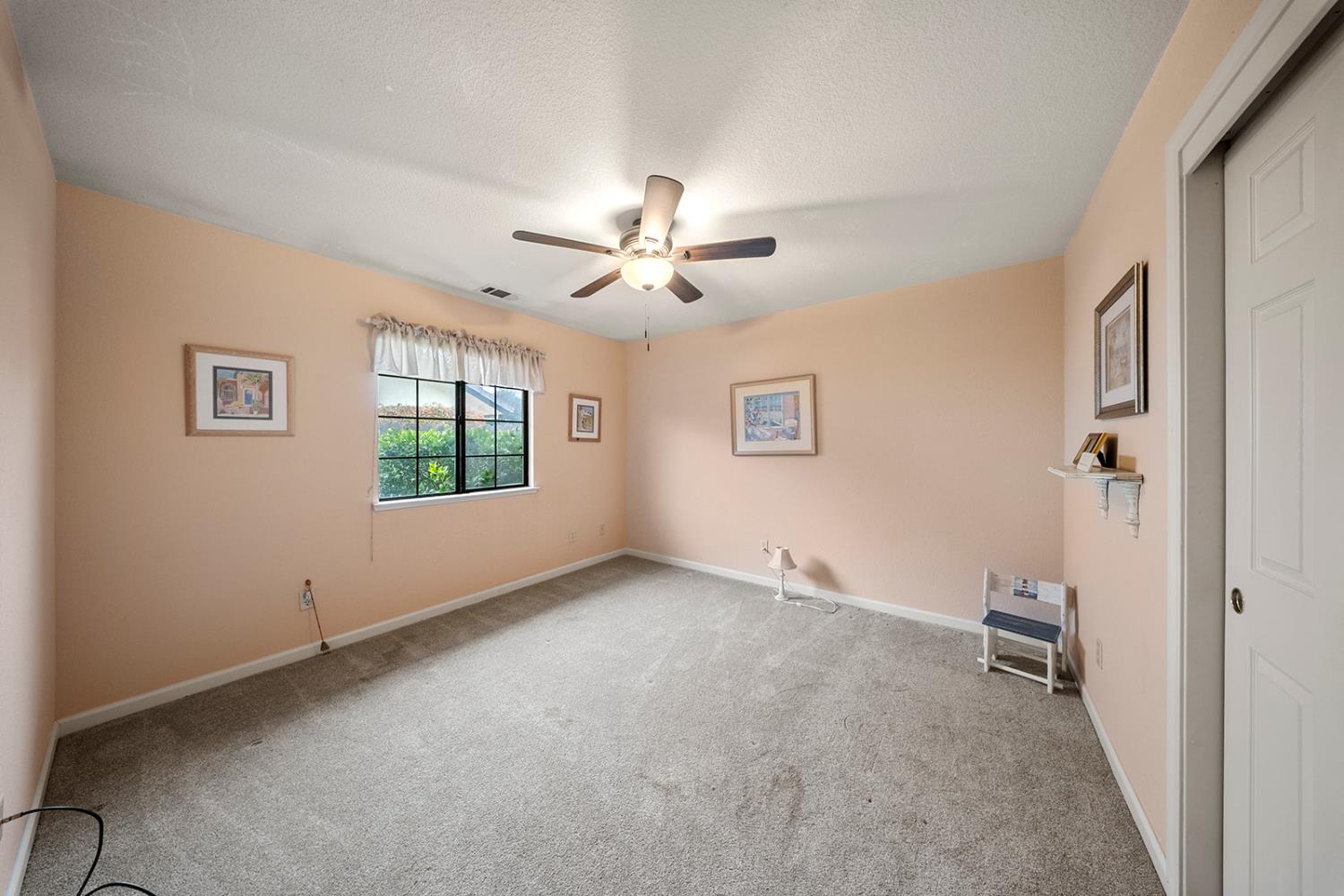 1837 Brookside Drive Manteca, CA 95336 - Photo 23 of 36 a view of an empty room with a window