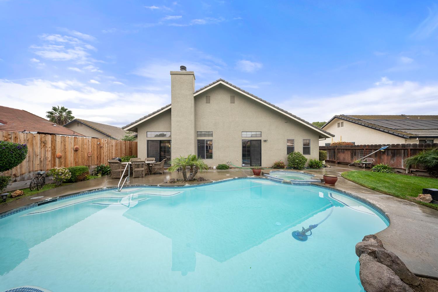 1837 Brookside Drive Manteca, CA 95336 - Photo 29 of 36 a view of a house with swimming pool and sitting area