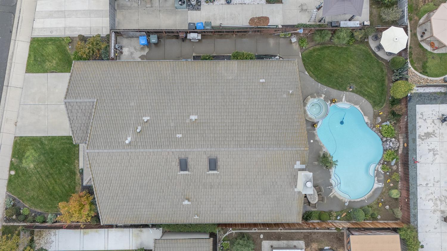 1837 Brookside Drive Manteca, CA 95336 - Photo 5 of 36 an aerial view of a house with a swimming pool