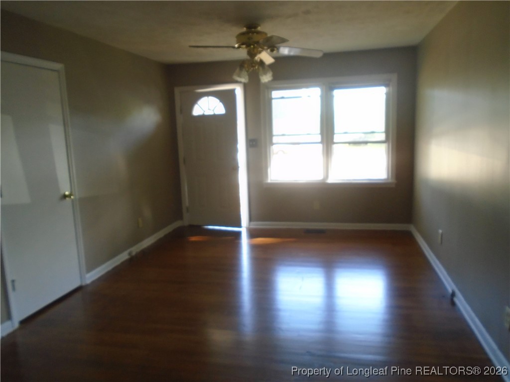611 Drypoint Lane, Unit 1 Hope Mills, NC 28348 - Photo 3 of 15 an empty room with wooden floor and windows