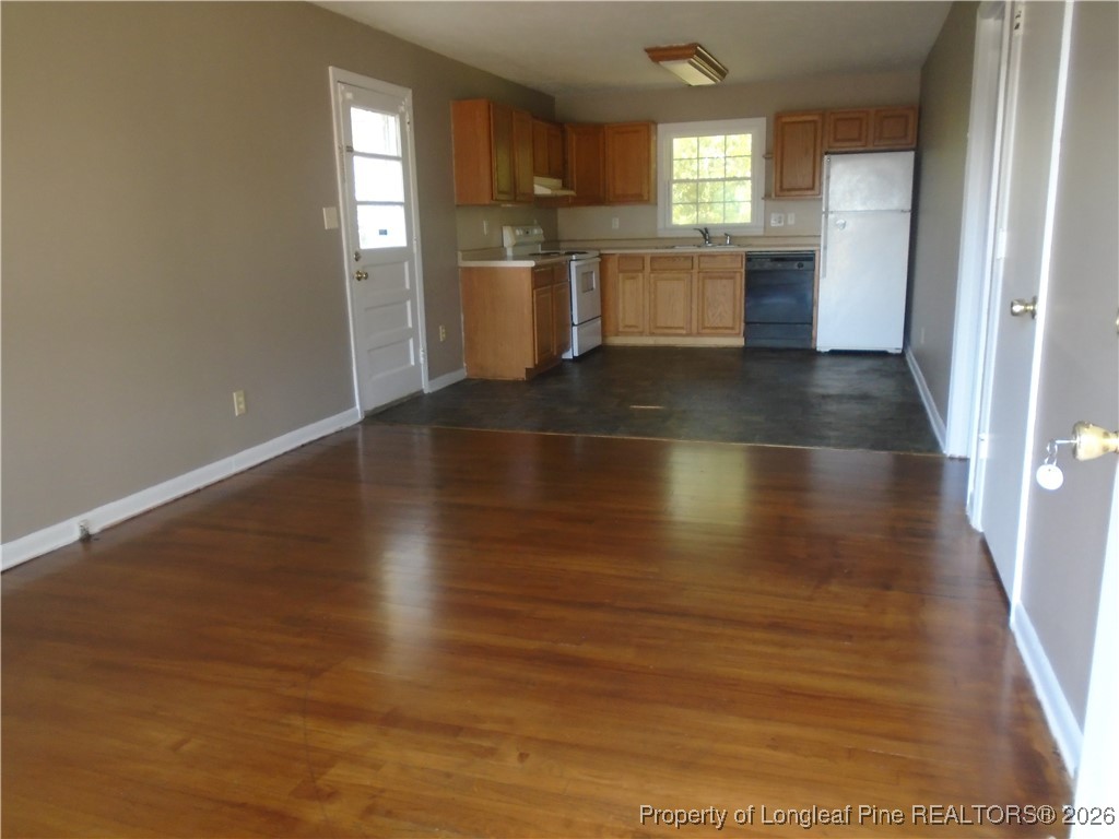 611 Drypoint Lane, Unit 1 Hope Mills, NC 28348 - Photo 6 of 15 an empty room with wooden floor and windows