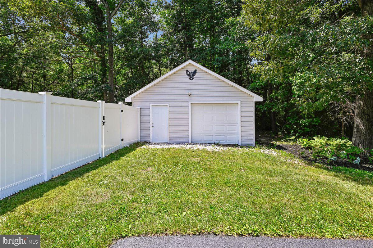603 Queenstown Road Severn, MD 21144 - Photo 72 of 85 Charming garage nestled in greenery.