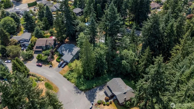 an aerial view of house with yard swimming pool and outdoor seating