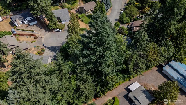an aerial view of house with yard