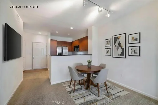 a kitchen with stainless steel appliances granite countertop a stove a refrigerator and a sink