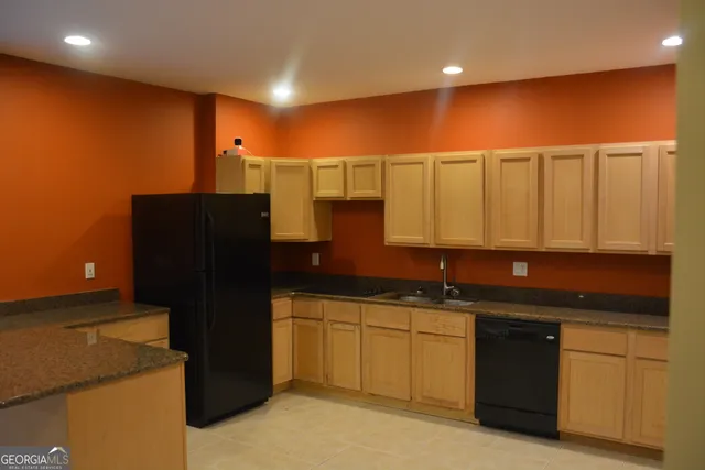 a view of room with wooden floor