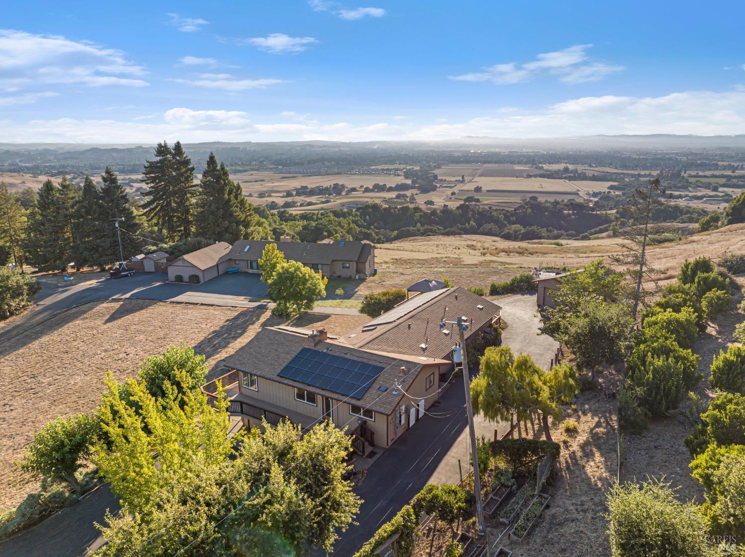 an aerial view of a house with a lake view