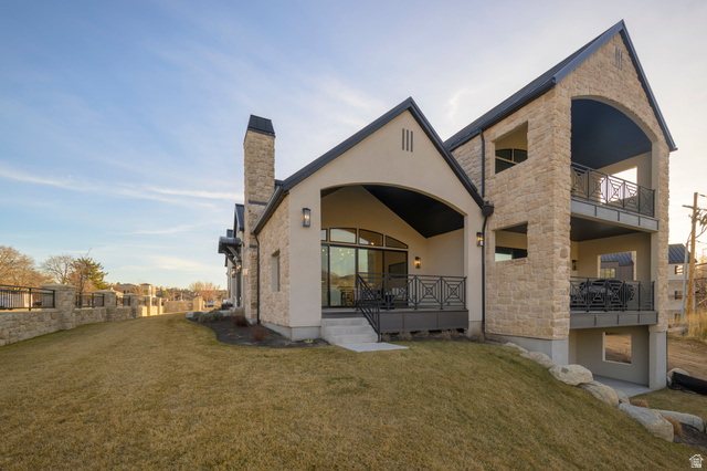 250 South Main Street, Unit 25 Alpine, UT 84004 - Photo 4 of 31 Rear view of property featuring stucco siding, a yard, stone siding, and a chimney