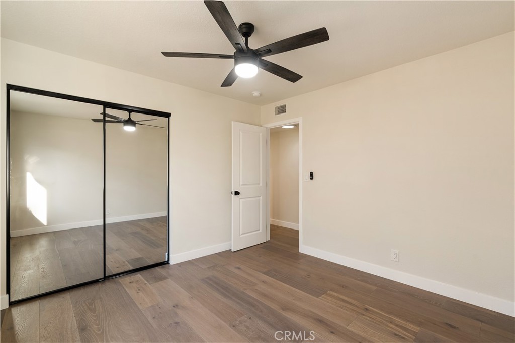 13601 Carroll Way Tustin, CA 92780 - Photo 14 of 28 wooden floor in an empty room