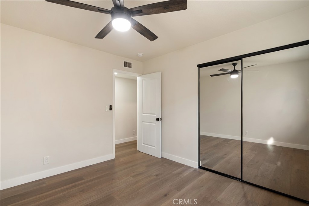 13601 Carroll Way Tustin, CA 92780 - Photo 16 of 28 a view of an empty room and wooden floor