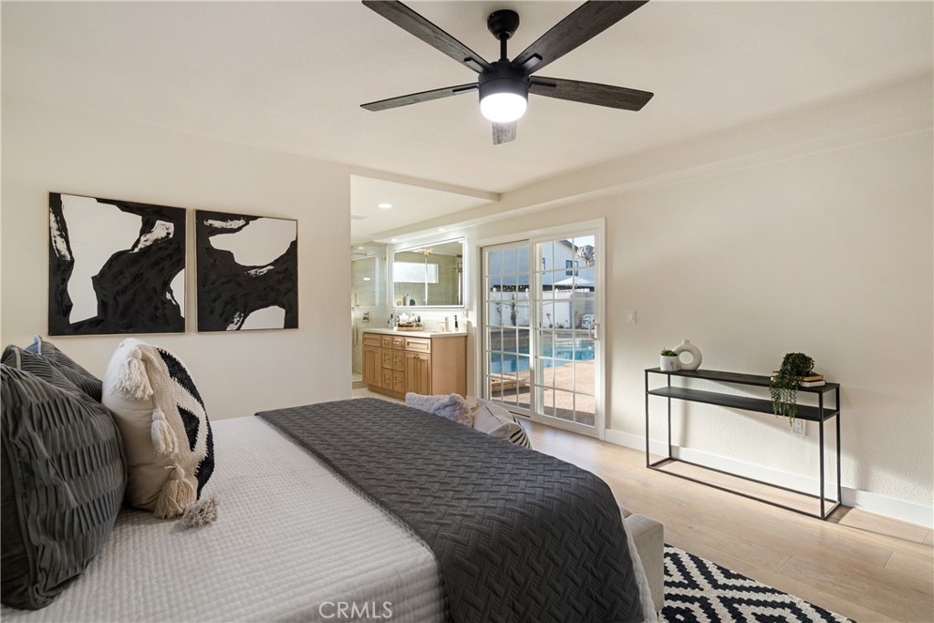 13601 Carroll Way Tustin, CA 92780 - Photo 20 of 28 a bedroom with a bed and a painting on the wall