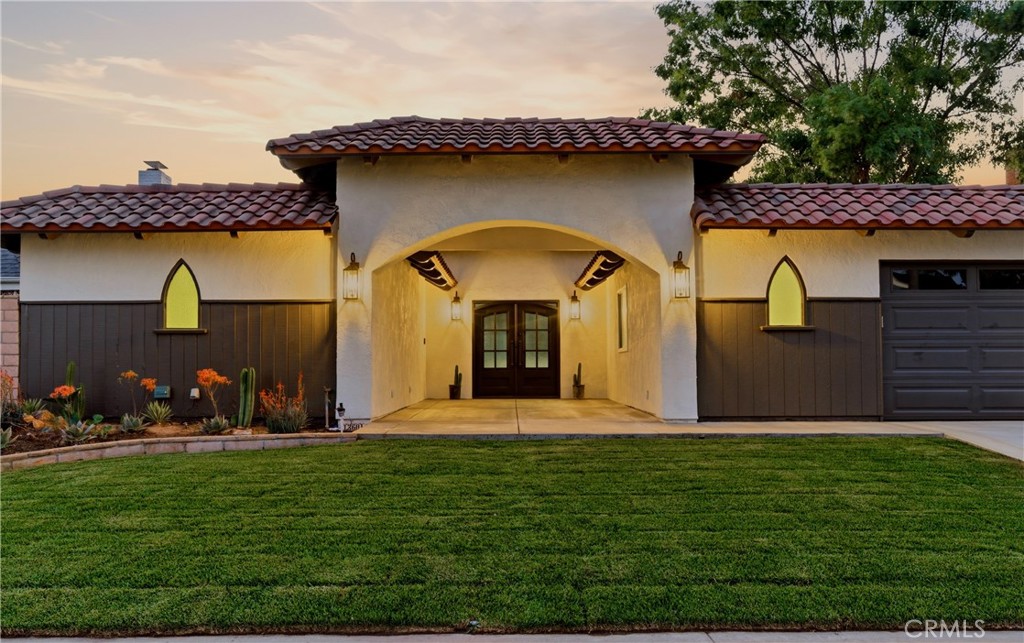 13601 Carroll Way Tustin, CA 92780 - Photo 2 of 28 a front view of a house with garden