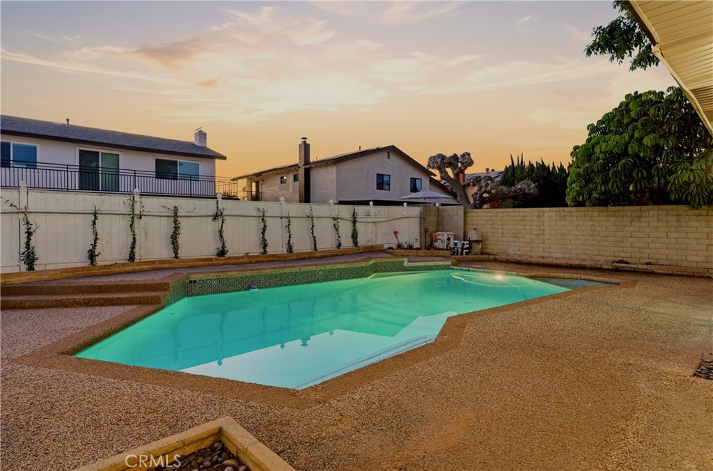 13601 Carroll Way Tustin, CA 92780 - Photo 24 of 28 a view of a house with a swimming pool