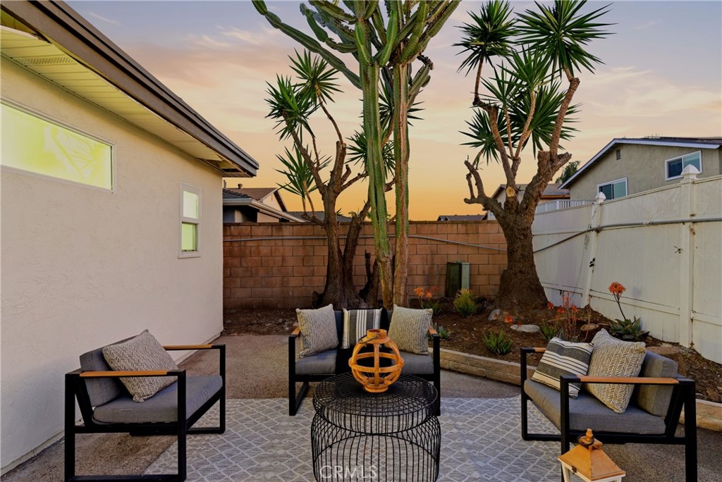 13601 Carroll Way Tustin, CA 92780 - Photo 25 of 28 a backyard of a house with barbeque oven table and chairs