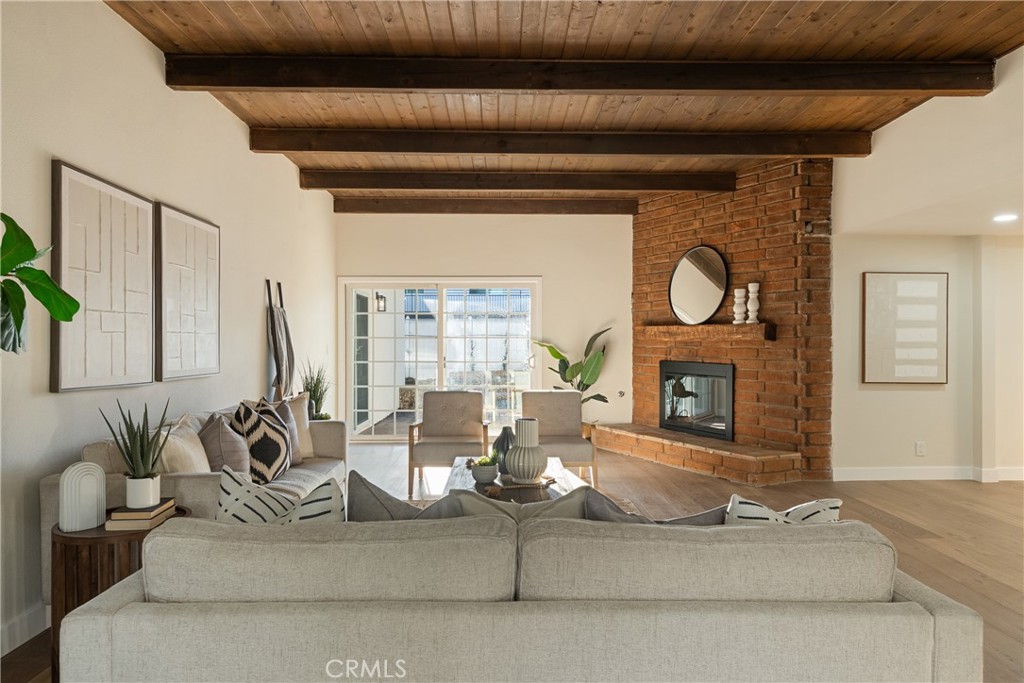 13601 Carroll Way Tustin, CA 92780 - Photo 3 of 28 a living room with fireplace furniture and a fireplace