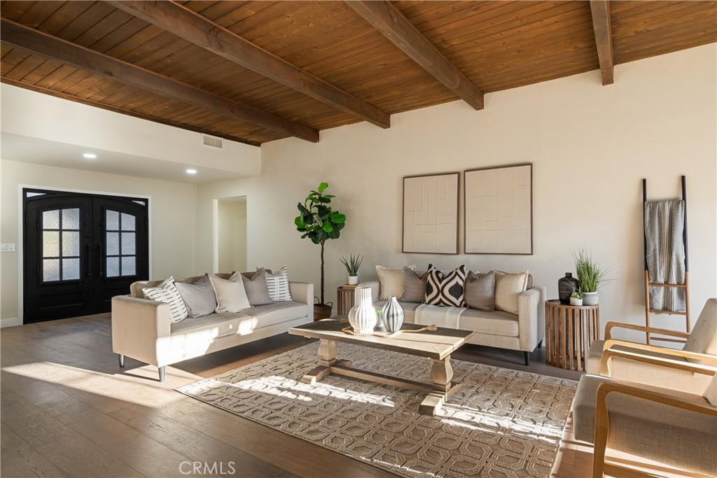 13601 Carroll Way Tustin, CA 92780 - Photo 4 of 28 a living room with furniture and wooden floor