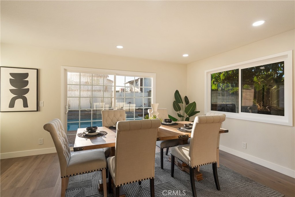 13601 Carroll Way Tustin, CA 92780 - Photo 10 of 28 a dining room with furniture a rug and a large window