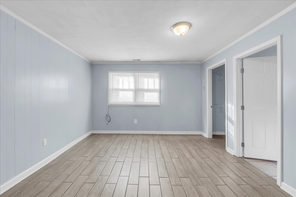 807 Perrigan Lane Manchester, TN 37355 - Photo 13 of 44 wooden floor in an empty room with a window
