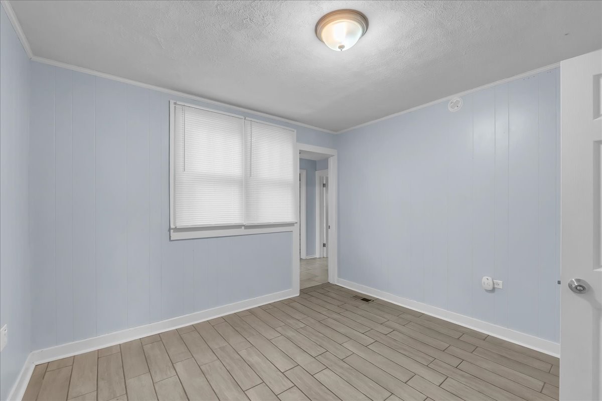 807 Perrigan Lane Manchester, TN 37355 - Photo 24 of 44 an empty room with wooden floor and windows