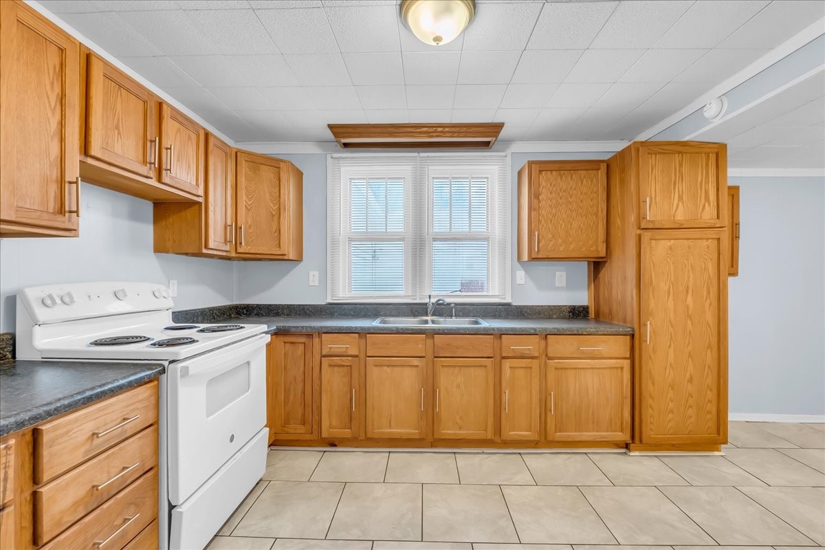 807 Perrigan Lane Manchester, TN 37355 - Photo 25 of 44 a kitchen with stainless steel appliances granite countertop a sink and cabinets